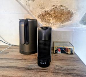 a phone sitting on the floor next to a box at Ονειρόπετρα 2 in Mouzaki