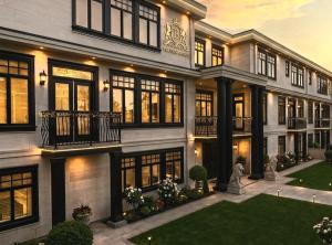 a large house with a lot of windows at Royal Boutique Hotel, Greater Vancouver in Surrey