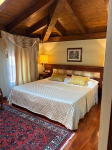 a bedroom with a large bed in a room at Le Muse Hotel in San Bonifacio