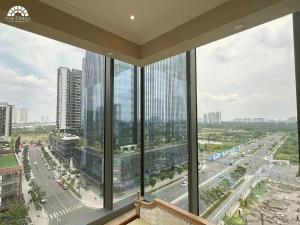a view of a city from a building with windows at ChiHome Metropole The Opera Residence Luxury in Ho Chi Minh City