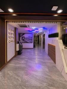 a hallway with purple lights in a building at TREMONT HOTEL BRONx-GRAND OPENING in Bronx