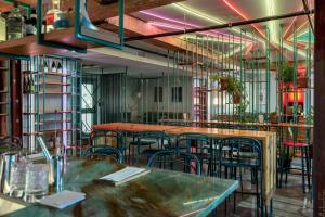 a room with tables and chairs in a restaurant at Schaeffer Hotel in New Orleans