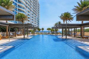 an image of a swimming pool at a resort at Luxury Ocean View 2BR in Riviera Beach