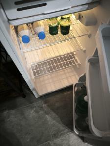 an open refrigerator with food inside of it at Due Orizzonti in Monsampolo del Tronto