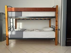 a bedroom with two bunk beds in a room at Hotel Erviliano in Borsh