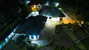 an aerial view of a house with a blue roof at Mwisongo Homestay in Morogoro