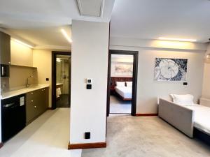 a room with two beds and a kitchen at ERTAN OTEL in Çeşme
