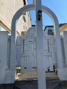 a white building with a sign in front of it at Fortuna hostel in Odesa +90 photos