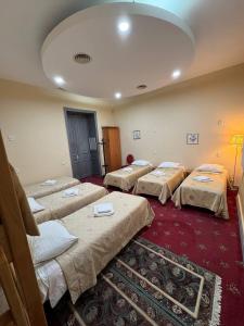 a room with four beds in a room at Fortuna hostel in Odesa