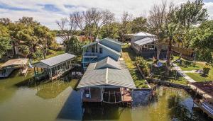 an aerial view of a house on a body of water at Lakefront Home on Water with Great Views, Boat Dock, Al Fresco Dining, and WiFi in Kingsland