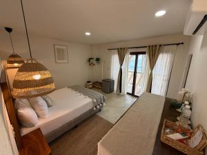 a bedroom with a bed with a bird cage on it at Seres Sayulita Beach Hotel in Sayulita