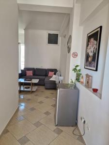 a living room with a couch and a table at Villa Noah in Berat