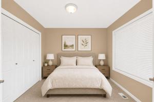 a bedroom with a large bed and two night stands at PINE AND TIMBER GETAWAY in Jackson +2 photos