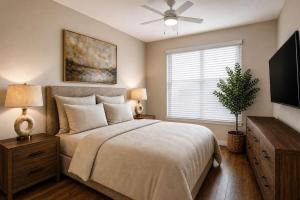 a bedroom with a bed and a ceiling fan at PINE AND TIMBER GETAWAY in Jackson