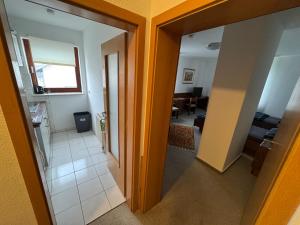 an open door to a room with a living room at Monteurwohnung Hohenstadt in Hohenstadt