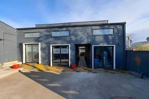 a building that is being remodeled with its doors open at 1 Comfortable loft with WiFi and central heating in Coihaique