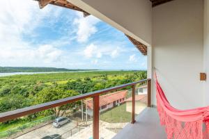 a view from the balcony of a house at River & Ocean View House with Pool in Igarassu