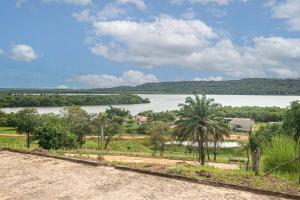 a view of a body of water with trees at River & Ocean View House with Pool in Igarassu