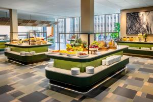 a buffet line with different types of food on display at NH Collection Copenhagen in Copenhagen