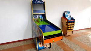 a video game console leaning against a wall at Hotel Los Delfines Melgar in Melgar