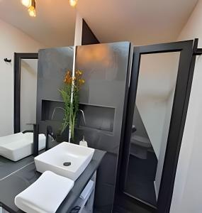 a bathroom with a sink and a mirror at 2 Family Lofts + central heating + comfort in Coihaique +23 photos