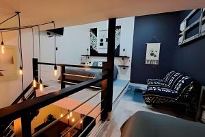 a living room with blue walls and a glass floor at 2 Family Lofts + central heating + comfort in Coihaique