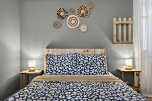 a bedroom with a bed and two lamps on the wall at Charming city in Lausanne
