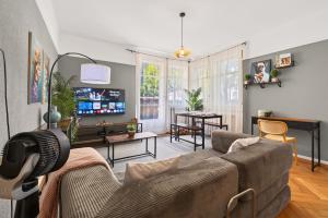 a living room with a couch and a table at Charming city in Lausanne