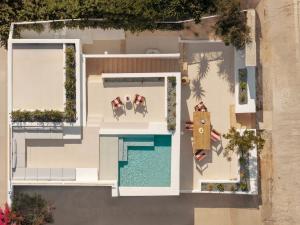 an overhead view of a house with a swimming pool at Villa Sol Mare Naousa, Paros in Naousa
