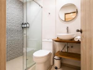 a bathroom with a shower and a toilet and a sink at Hotel Azure Cartagena in Cartagena de Indias