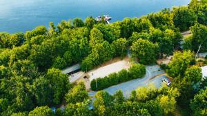 an aerial view of a river and trees at Basecamp Brno in Brno