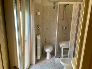 a bathroom with a shower and a toilet and a sink at Hotel Sud America in Fiuggi +26 photos