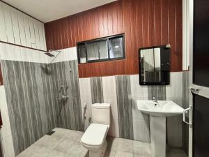 a bathroom with a toilet and a sink at Hamadhi guest in Haldummulla +190 photos
