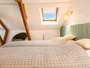 a bedroom with a bed and a window at maison cosy centre ville in Ham