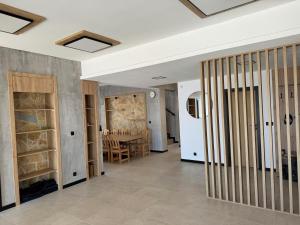 a hallway with a dining room and a table at villa efraim read the details from the host for approval in Athens