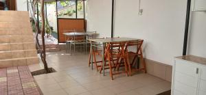 a kitchen with a table and chairs in a room at Vila Angeli in Techirghiol