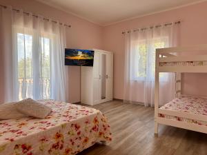 a bedroom with a bed and a bunk bed at La Sabinese in Frasso Sabino