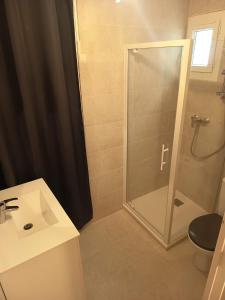 a bathroom with a shower and a sink at SUITE CHARABOIS in Saint-Raphaël