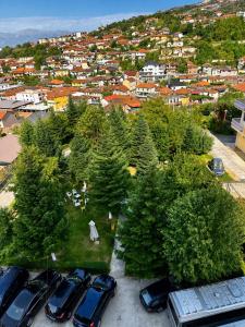 an aerial view of cars parked in a parking lot at Hotel Klajdi in Peshkopi