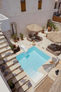 a swimming pool in the middle of a courtyard at Casa Moro in Episkopi 16km from Rethymno in episkopi-chania