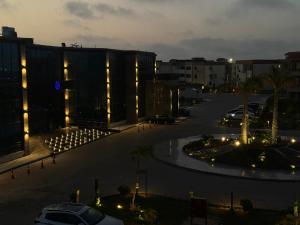 a view of a city street at night at Helnan portfouad chalet in Chantier Island