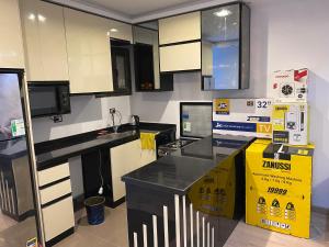 a kitchen with a counter and boxes in it at Helnan portfouad chalet in Chantier Island
