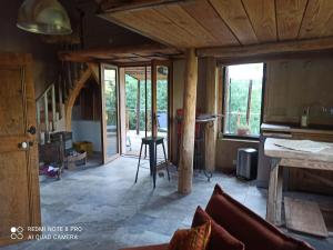 a living room with a couch and a table at Gîte au calme 