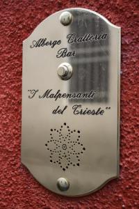 a lightswitch on a wall with writing on it at I Malpensanti del Trieste in Monticelli dʼOngina