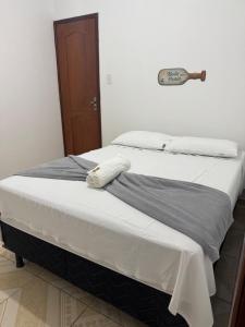 two beds sitting next to each other in a room at Hotel Ipê Centro in Barreirinhas