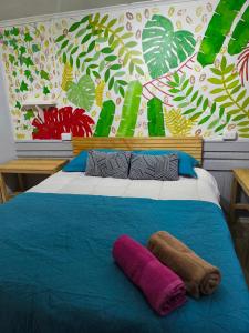 a bed with two towels on top of it at Isla Yu Patagonia 2 in Puerto Natales +26 photos