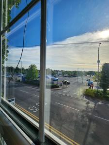a view of a city street from a window at The Iris in Grays Thurrock