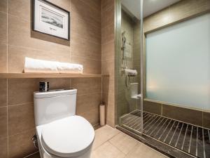 a bathroom with a toilet and a shower at Atour Hotel Hefei Hitech Avenue in Hefei