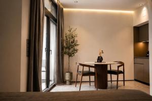 a dining room with a table and a window at Valverda - Boutique Apartments in Grödig