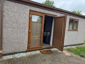 an open door of a house with a patio at Self contained Coventry in Coventry +2 photos